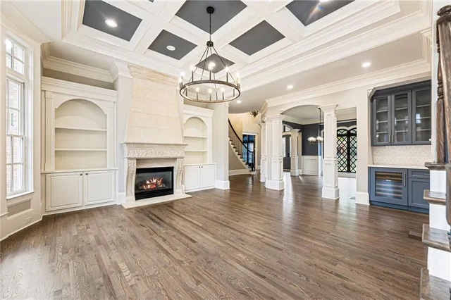 a bathroom with a granite countertop toilet sink and mirror
