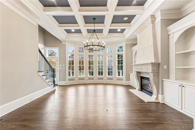 a bathroom with a sink a toilet a mirror and shower
