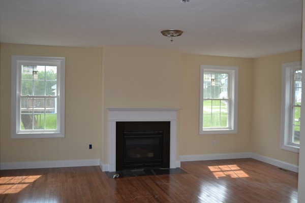 4 Waxen Way Shirley, MA 01464 - Photo 12 of 12 an empty room with wooden floor windows and fireplace