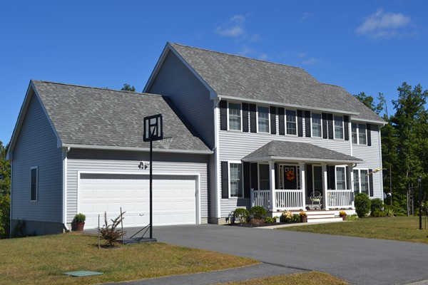 4 Waxen Way Shirley, MA 01464 - Photo 2 of 12 a front view of a house with garden