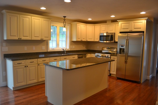 4 Waxen Way Shirley, MA 01464 - Photo 3 of 12 a kitchen with stainless steel appliances granite countertop a refrigerator a sink and a stove