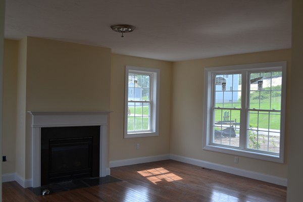 4 Waxen Way Shirley, MA 01464 - Photo 9 of 12 a view of an empty room with wooden floor and a window