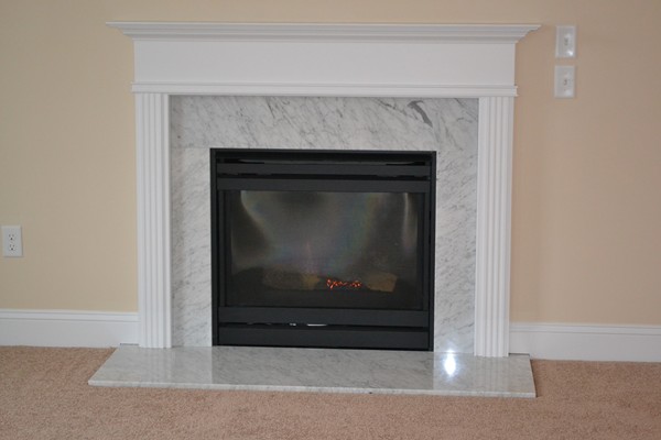 4 Waxen Way Shirley, MA 01464 - Photo 10 of 12 a living room with a fireplace
