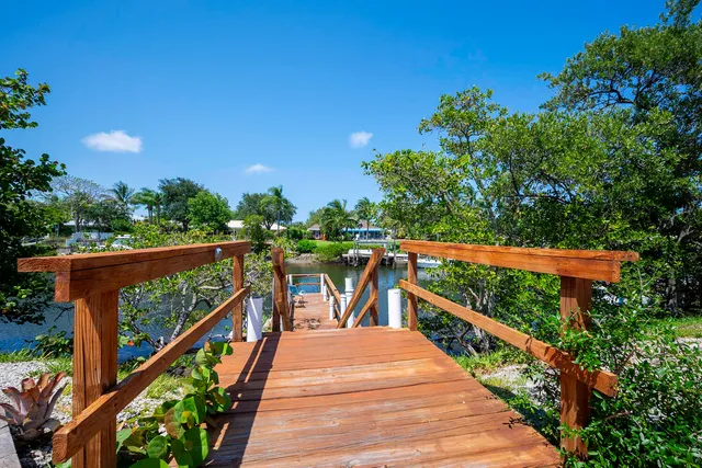 a view of a balcony with wooden stairs