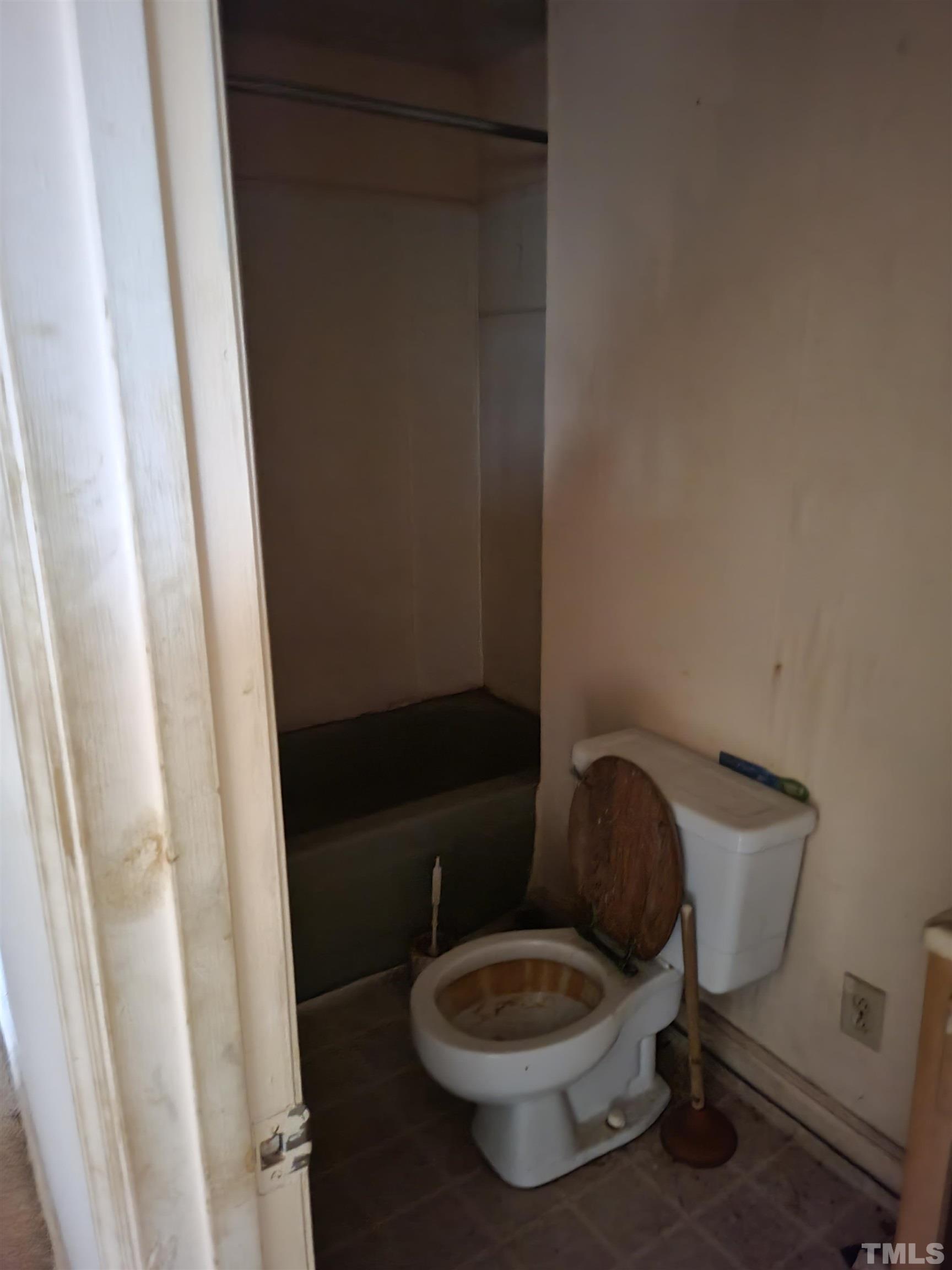 7808 Russell Road Durham, NC 27712 - Photo 4 of 8 a bathroom with a toilet and a sink