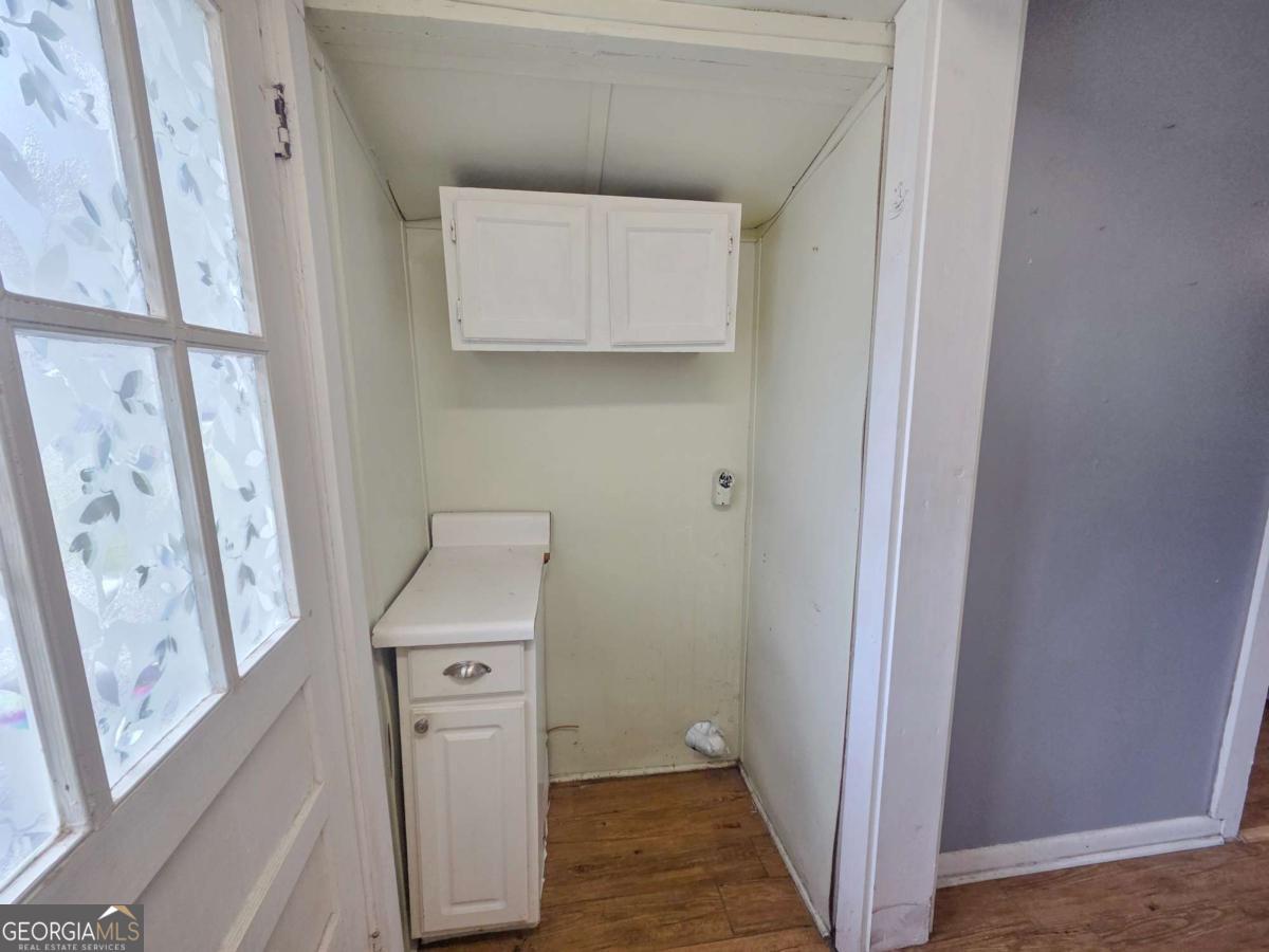 188 Holmesville Road Baxley, GA 31513 - Photo 10 of 20 a utility room with a sink a refrigerator and washer