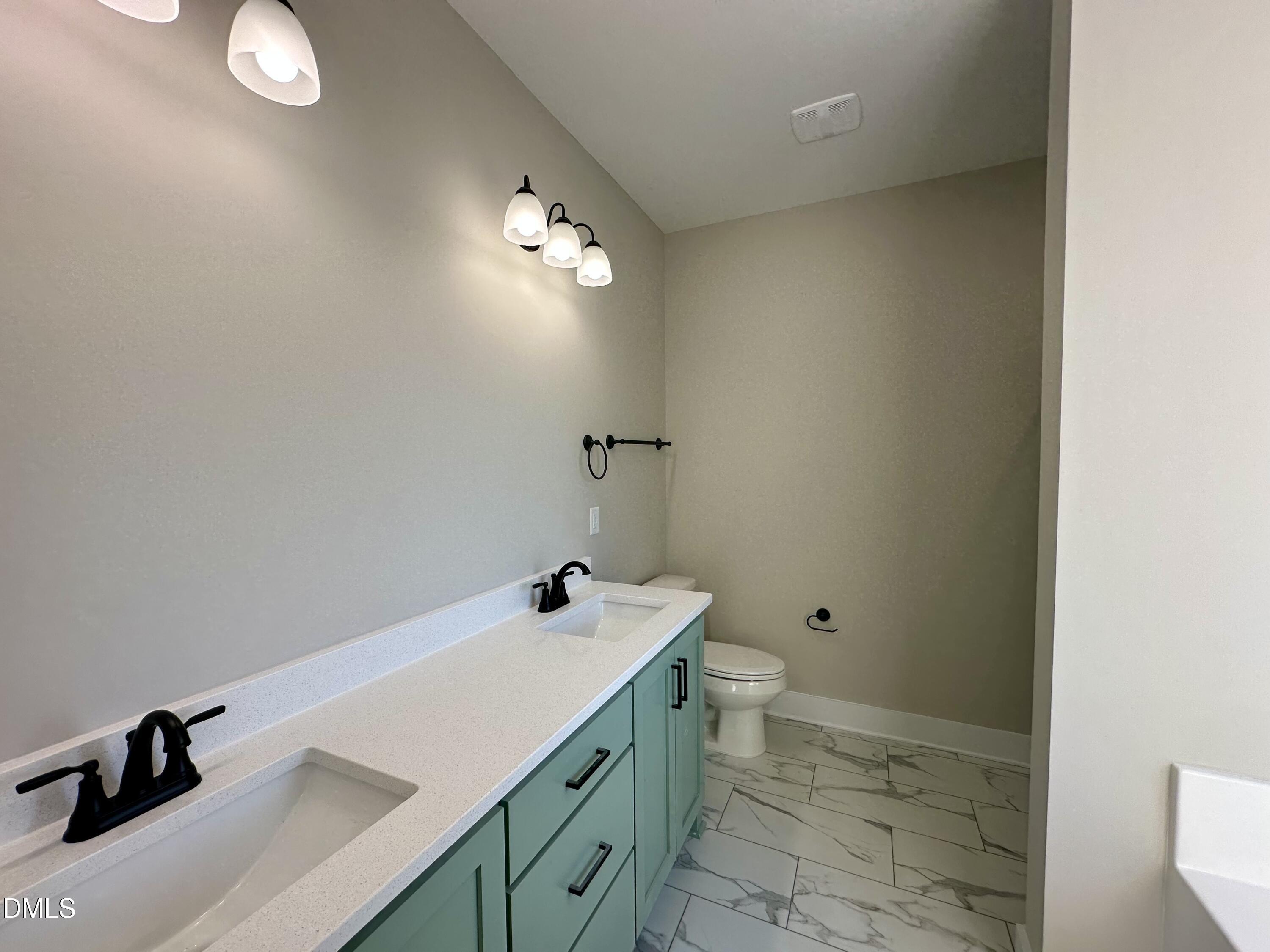165 Bay Valley Road Kenly, NC 27542 - Photo 11 of 22 a bathroom with a sink and a vanity