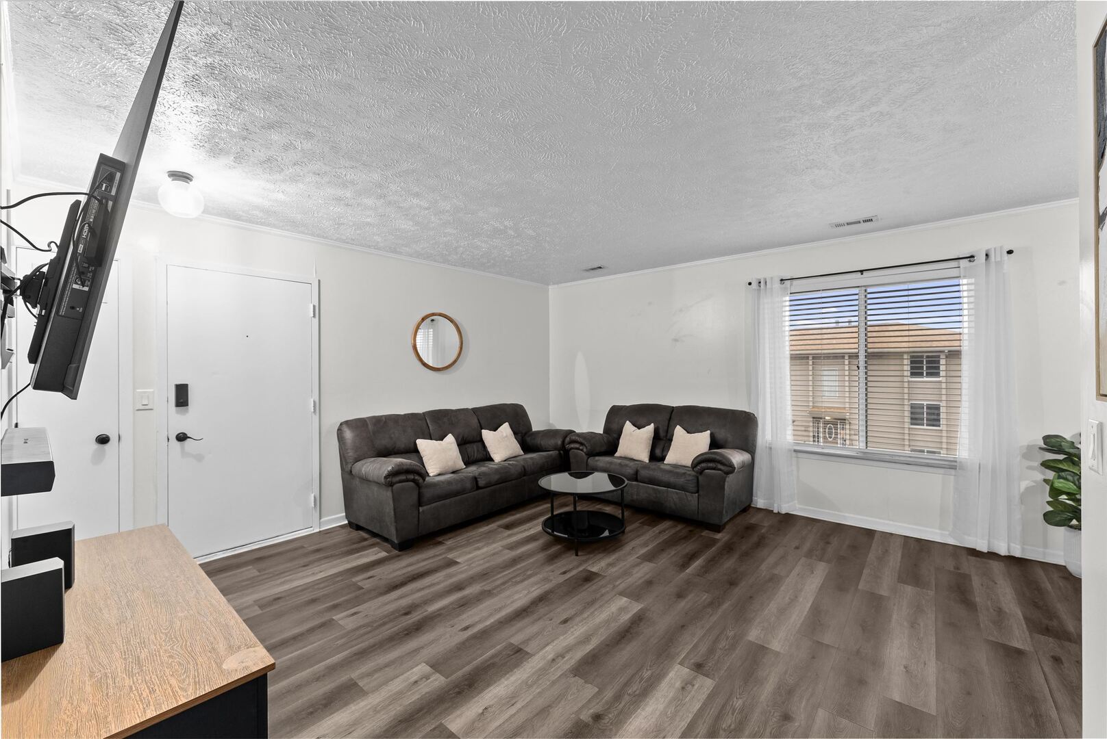 1808 53rd Street, Unit 5 Moline, IL 61265 - Photo 3 of 14 a living room with furniture and a wooden floor