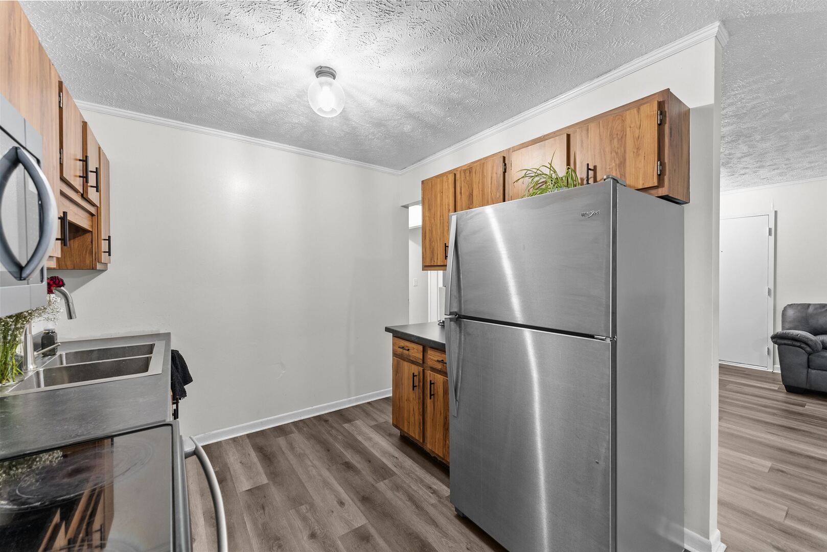 1808 53rd Street, Unit 5 Moline, IL 61265 - Photo 5 of 14 a white refrigerator freezer sitting in a kitchen