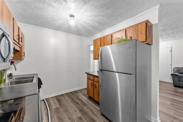 a white refrigerator freezer sitting in a kitchen