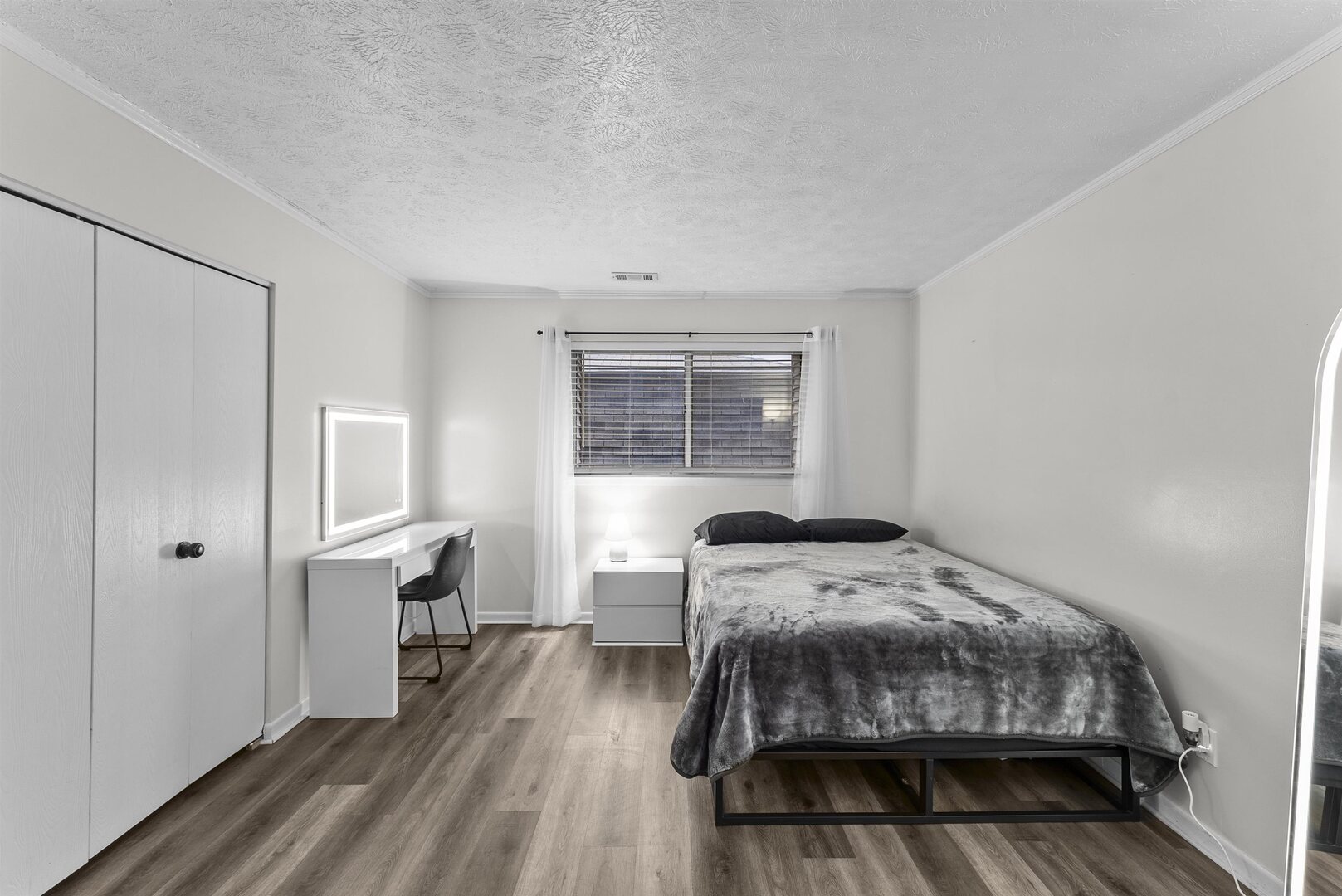 1808 53rd Street, Unit 5 Moline, IL 61265 - Photo 9 of 14 a bedroom with a bed and wooden floor