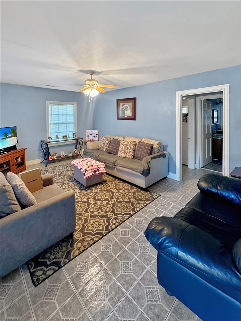 203 Dellwood Street Bryan, TX 77801 - Photo 3 of 9 a living room with furniture and a couch