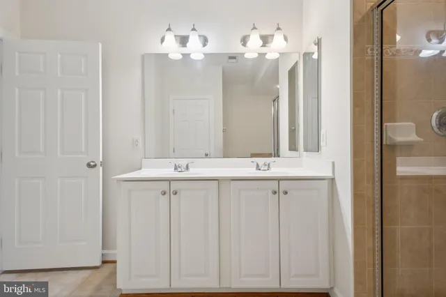 a bathroom with a shower a toilet and a shower