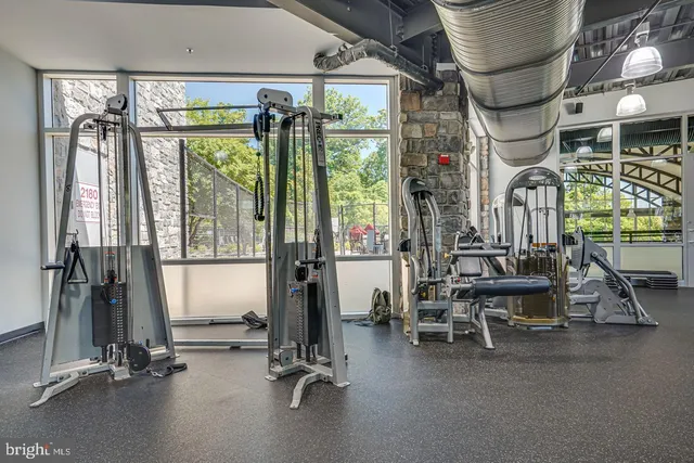 a view of a swimming pool with a patio and a yard