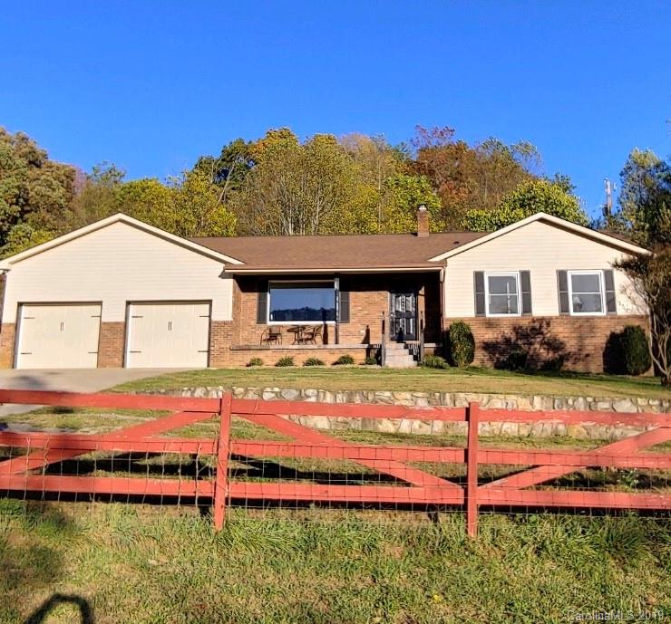 371 Murray Road Canton, NC 28716 - Photo 1 of 25 a front view of a house with a yard