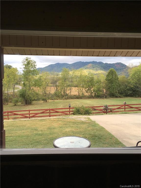 371 Murray Road Canton, NC 28716 - Photo 4 of 25 a view of a lake from a yard