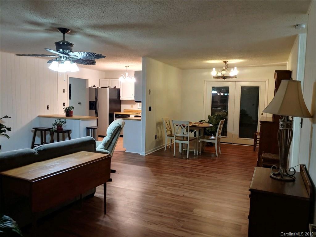 371 Murray Road Canton, NC 28716 - Photo 6 of 25 a view of a dining room with furniture and chandelier