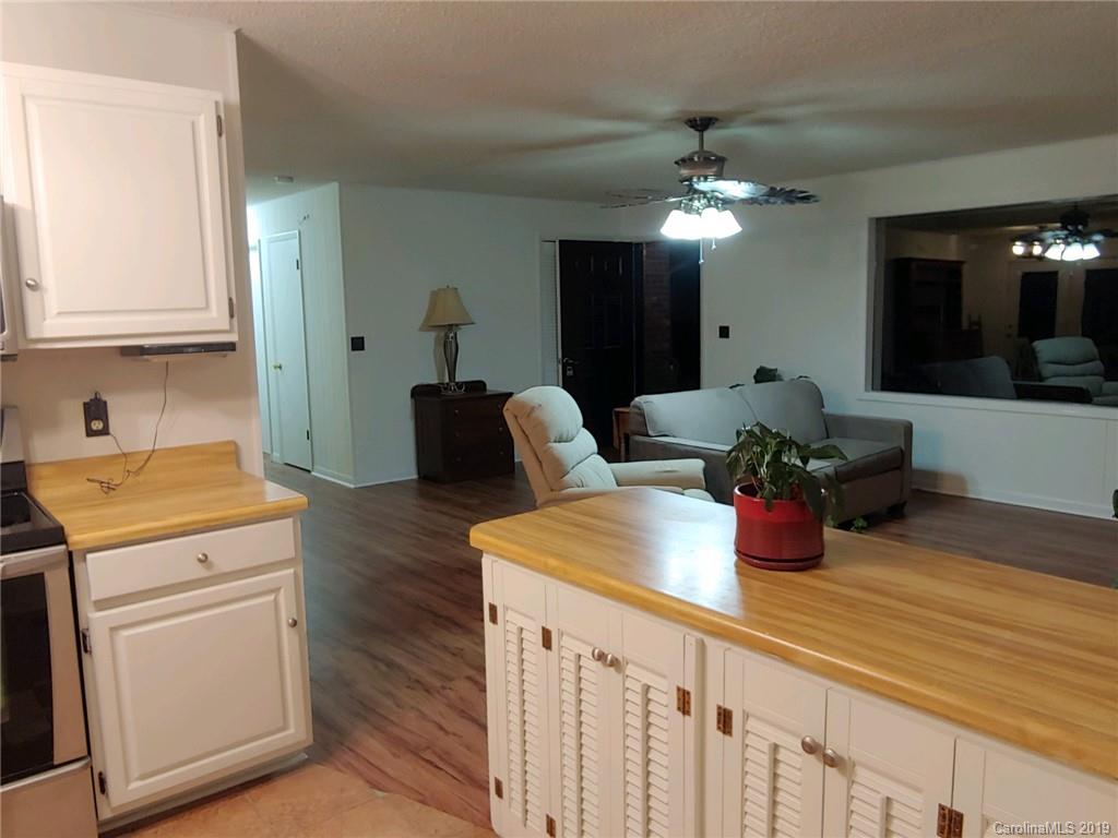 371 Murray Road Canton, NC 28716 - Photo 9 of 25 a kitchen with a sink and chandelier