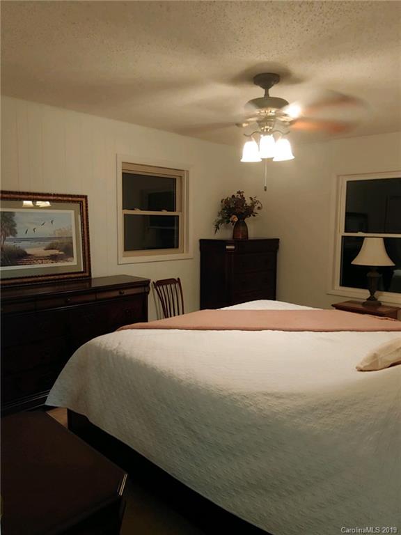 371 Murray Road Canton, NC 28716 - Photo 10 of 25 a bedroom with a bed and a flat screen tv