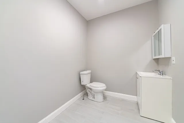 a bathroom with a sink a toilet and bathtub