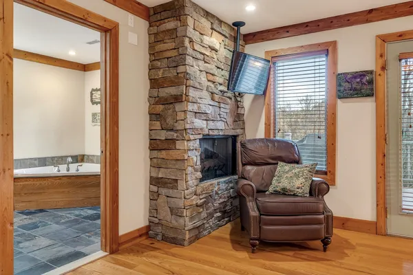 a bathroom with a double vanity sink a mirror and a bathtub