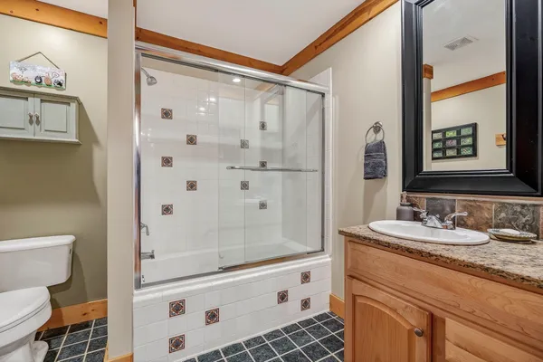 a living room with a bed furniture and a window
