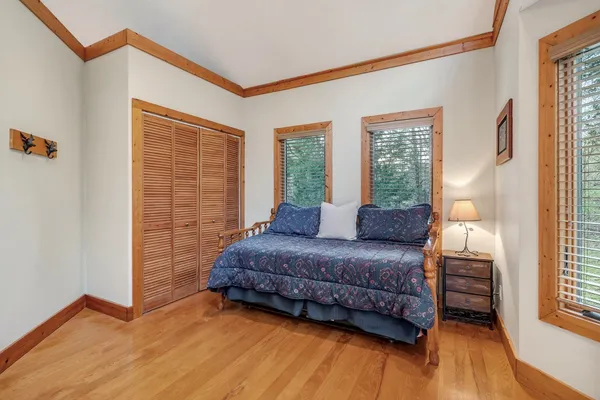 a living room with fireplace furniture and a large window