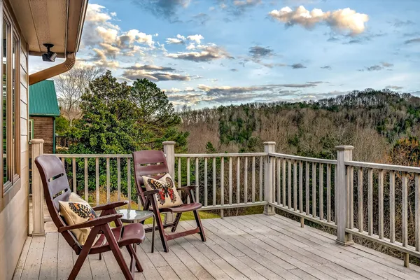 a living room with fireplace furniture and a flat screen tv