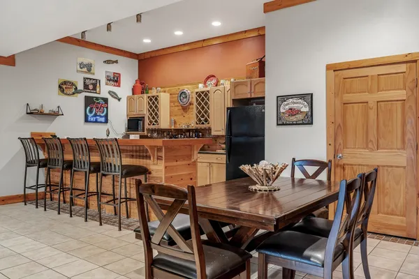 a very nice looking room with large windows and furniture