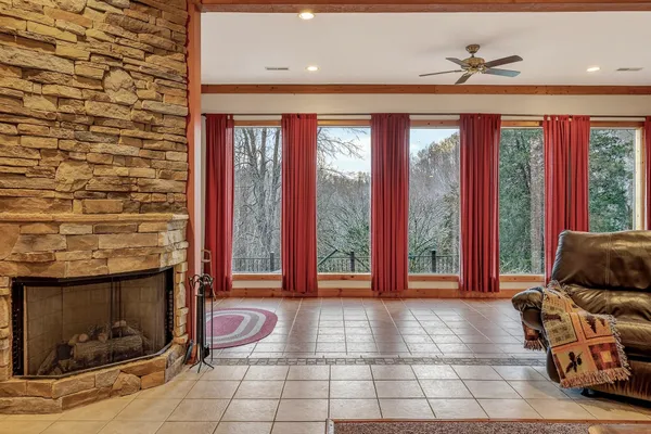 a view of a house with pool and a yard