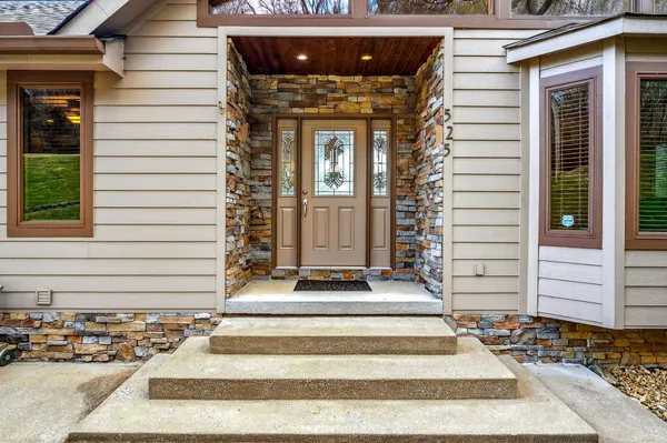 a living room with fireplace furniture and a wooden floor