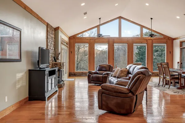 a living room with furniture and a flat screen tv