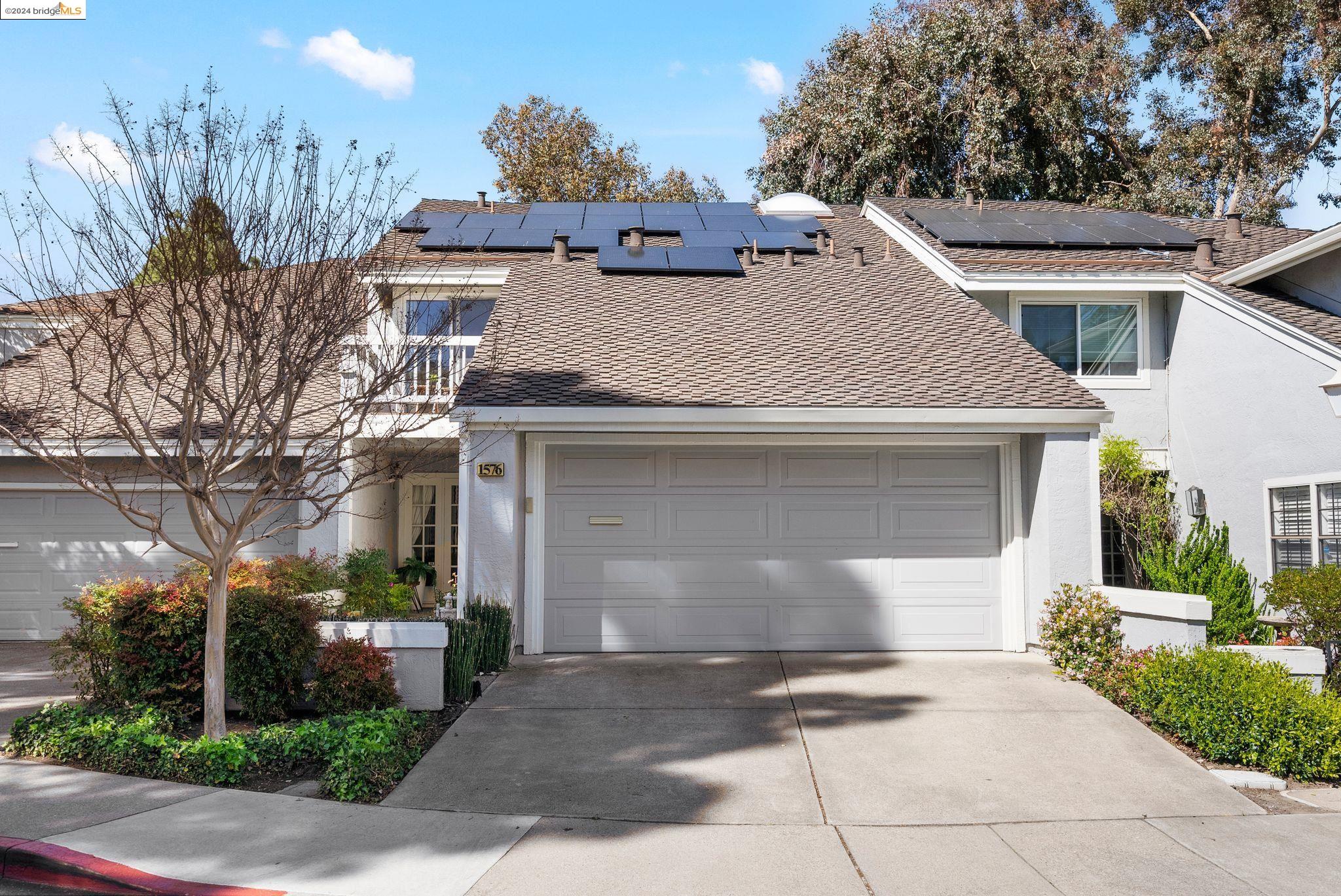 1576 Gilboa Drive Walnut Creek, CA 94598 - Photo 1 of 1 a view of a white house with a yard and plants
