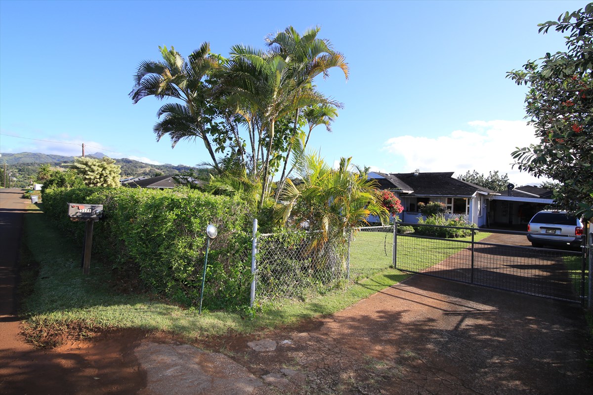 3378 Hailima Road Koloa, HI 96756 - Photo 2 of 8 a green field with some trees in front of it