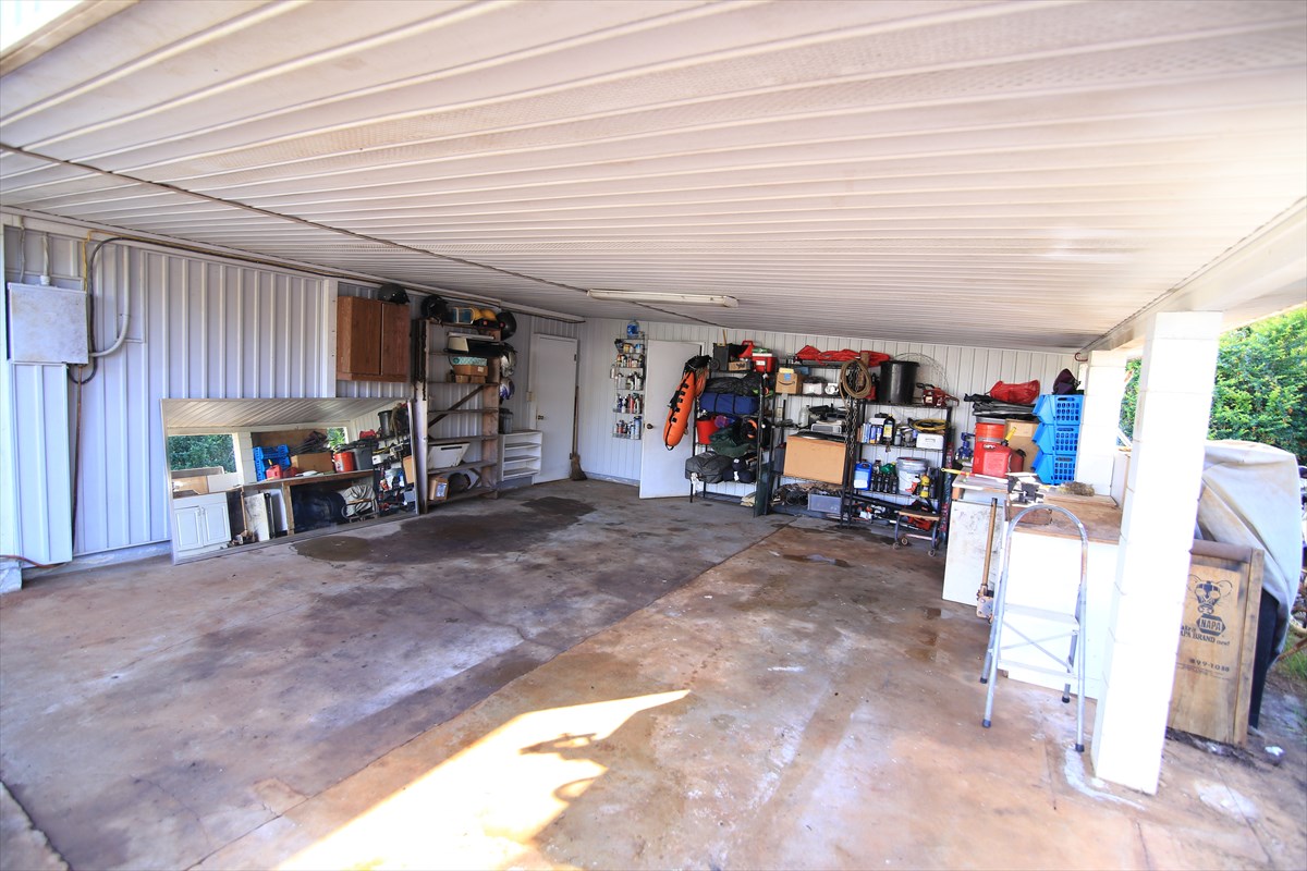 3378 Hailima Road Koloa, HI 96756 - Photo 8 of 8 a view of a garage with a bike and car