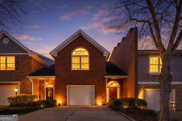 a front view of a building with a sign board