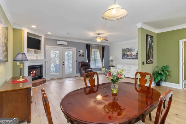 a kitchen with stainless steel appliances granite countertop a refrigerator a stove and a sink