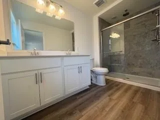 an empty room with windows and closet