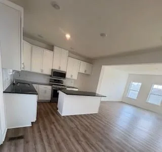 a view of kitchen and a window