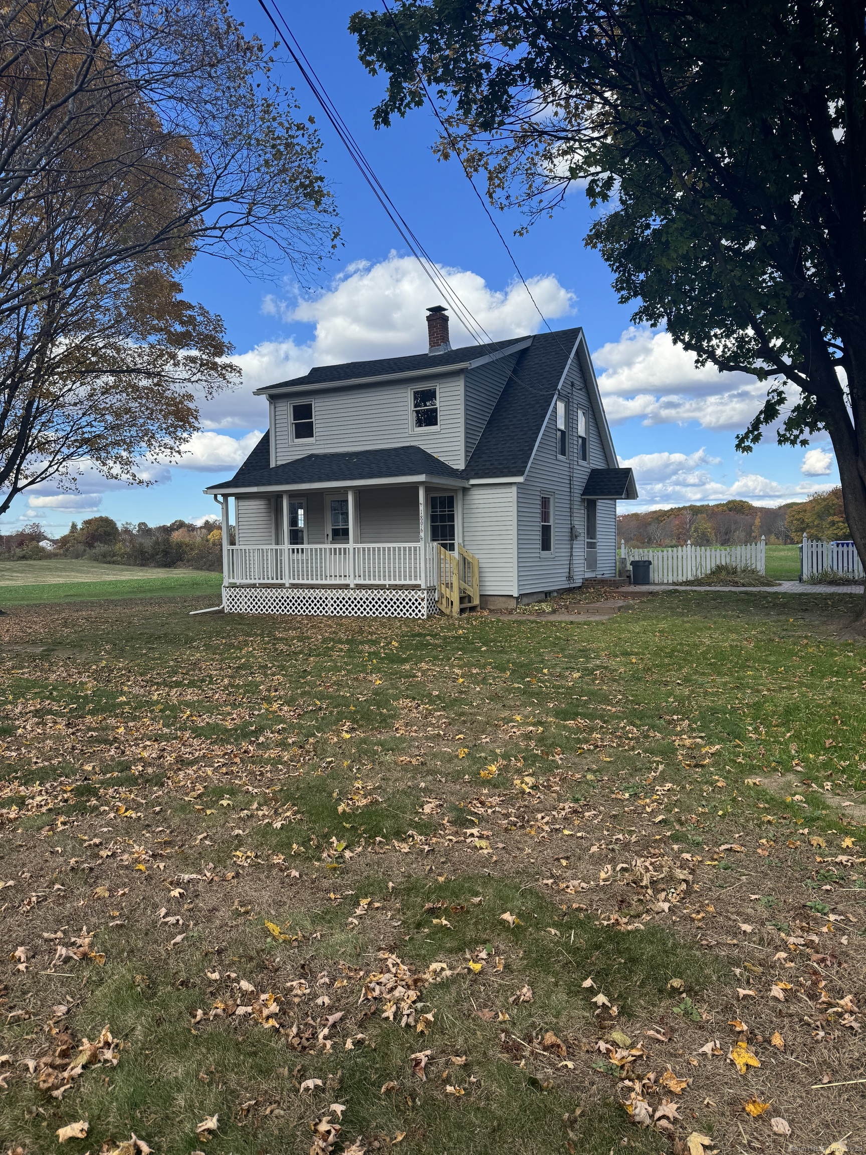 1896 Spruce Street West Suffield, CT 06093 - Photo 1 of 11 a white house sitting in middle of a field
