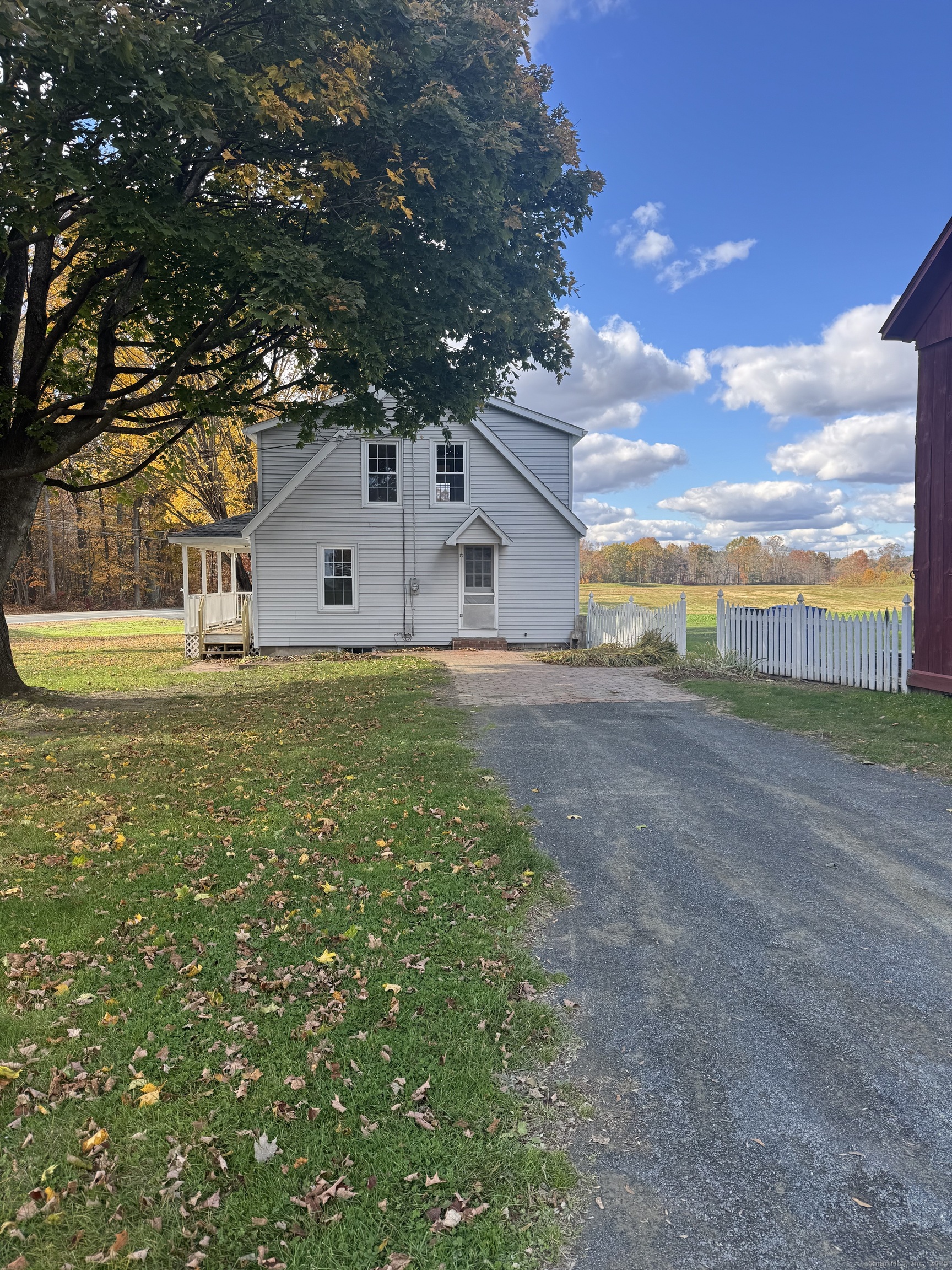 1896 Spruce Street West Suffield, CT 06093 - Photo 2 of 11 a front view of a house with a yard and garage