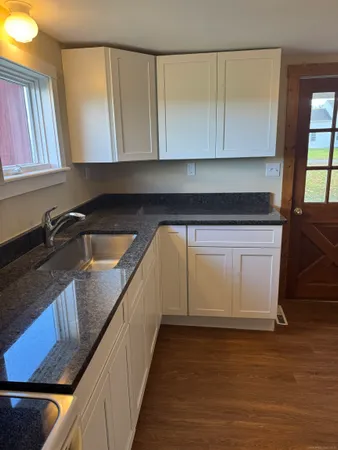 a kitchen with a sink and cabinets