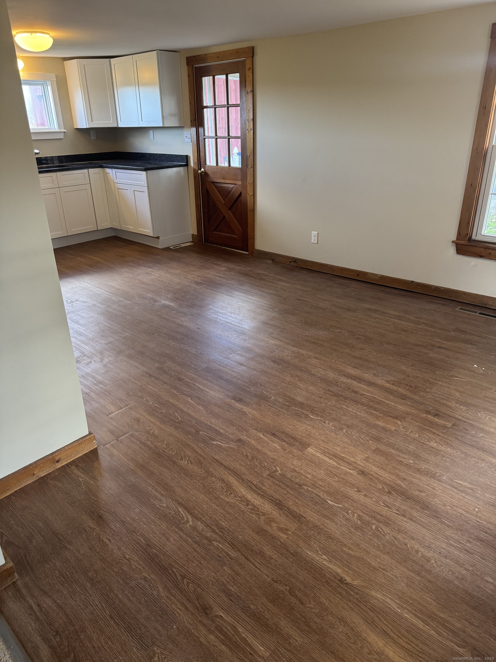 1896 Spruce Street West Suffield, CT 06093 - Photo 7 of 11 an empty room with wooden floor and windows