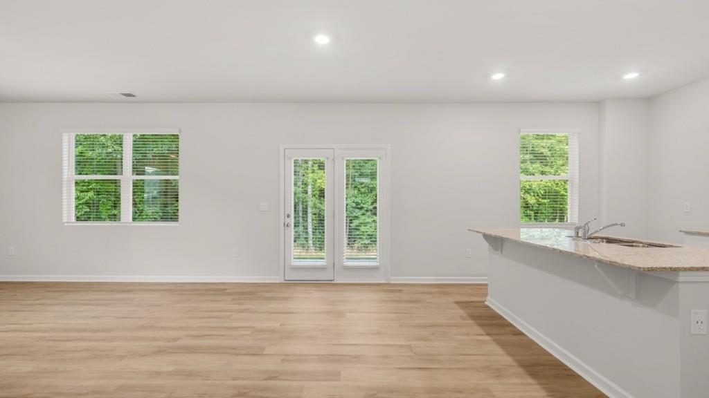 517 Oak View Lane Dallas, GA 30157 - Photo 9 of 41 a view of an empty room with wooden floor and a window