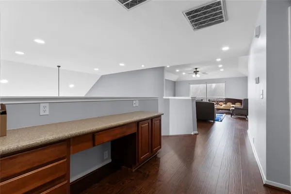 a kitchen with a sink appliances and cabinets