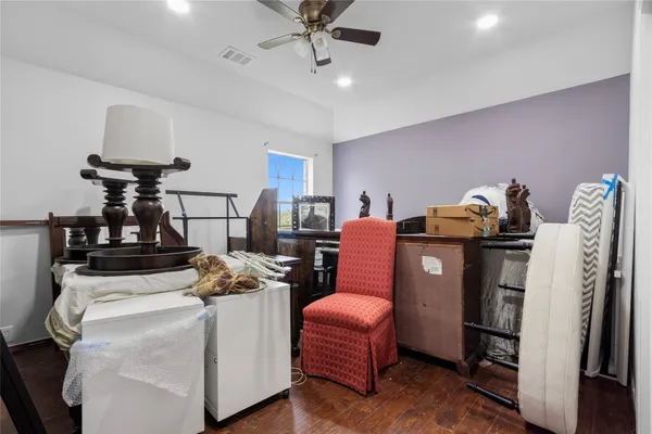 a bed room with furniture and wooden floor
