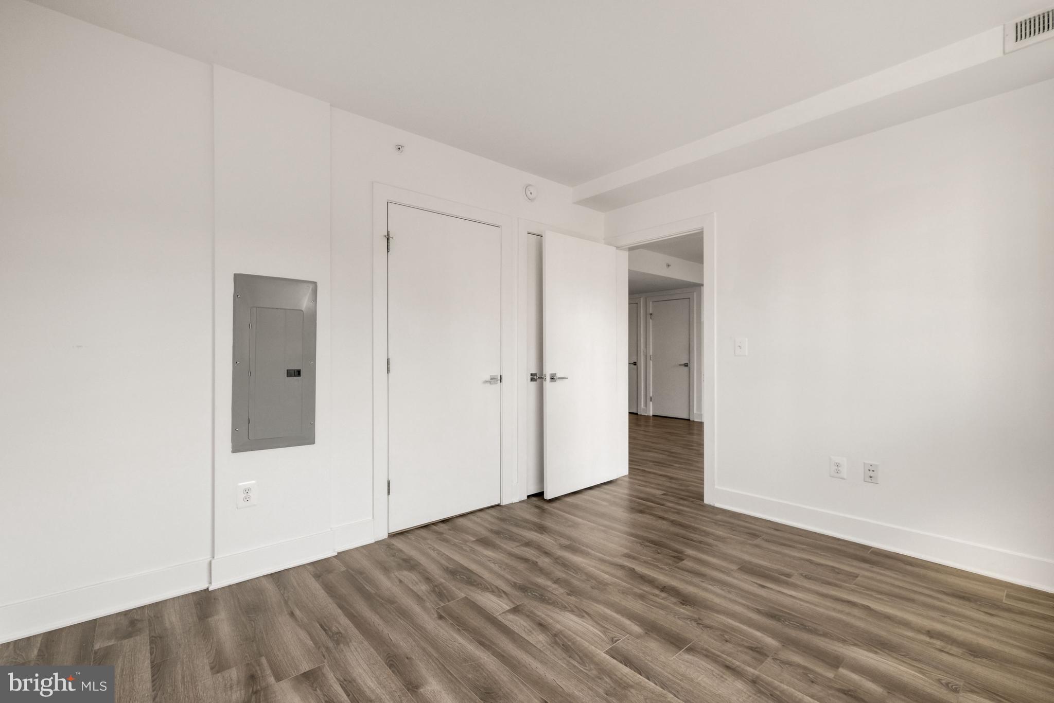 1311 13th Street Northwest, Unit 409 Washington, DC 20005 - Photo 15 of 25 a view of an empty room with wooden floor