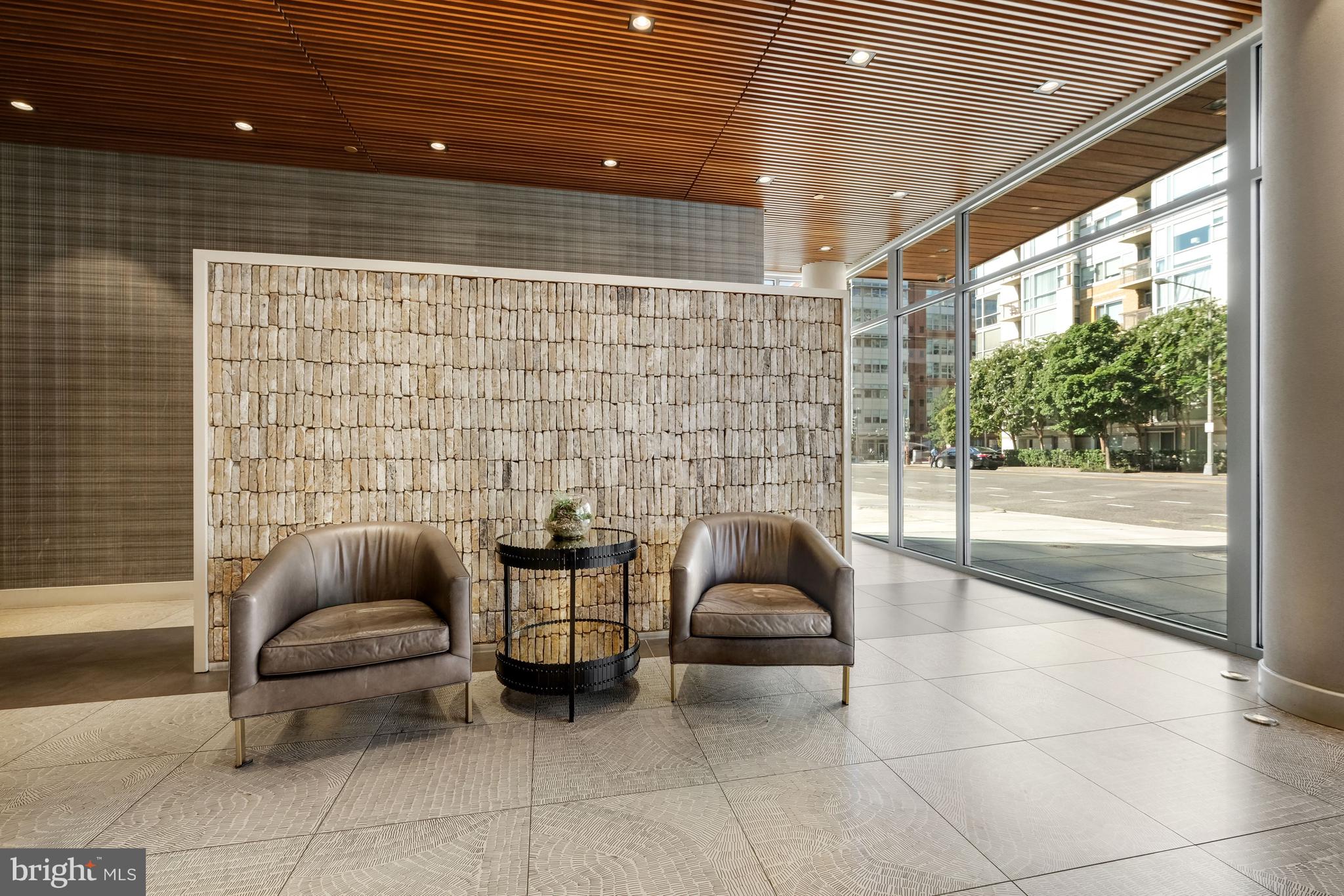 1311 13th Street Northwest, Unit 409 Washington, DC 20005 - Photo 2 of 25 a outdoor space with patio couch and a fireplace