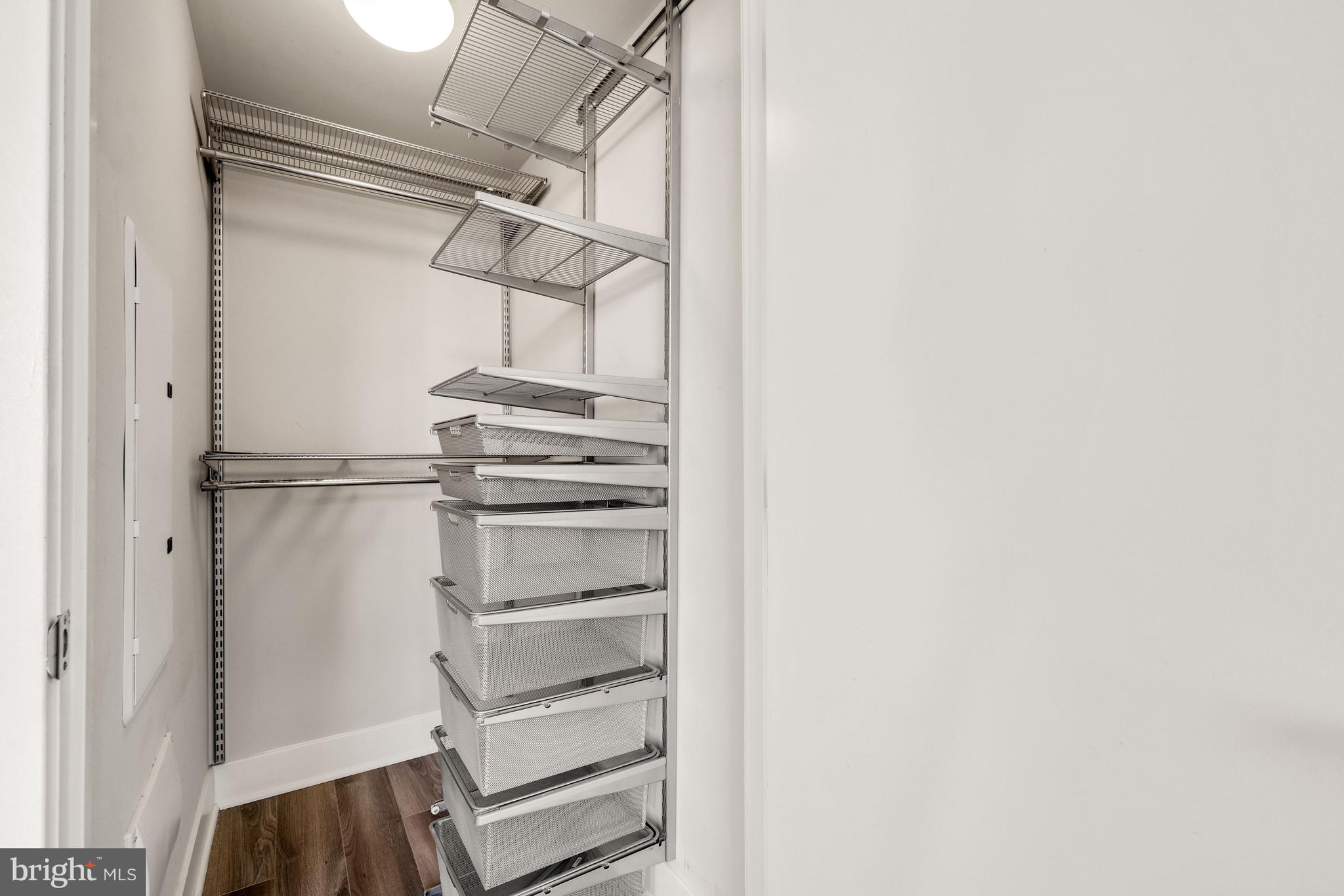 1311 13th Street Northwest, Unit 409 Washington, DC 20005 - Photo 21 of 25 a view of walk in closet with empty racks