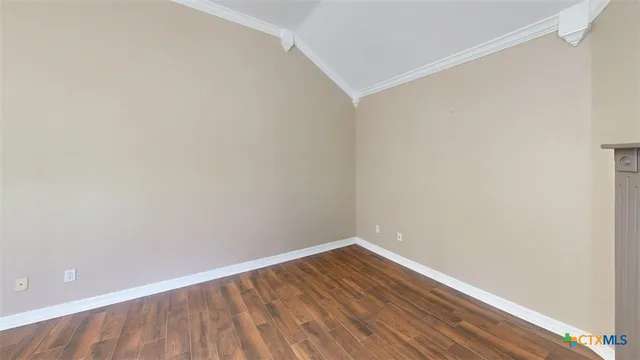 a view of living room with furniture and wooden floor